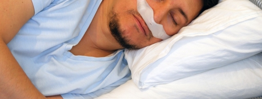 man wearing under the nose nasal mask and using cpap machine for picture id1191282564