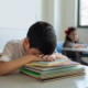 child sleeping at school